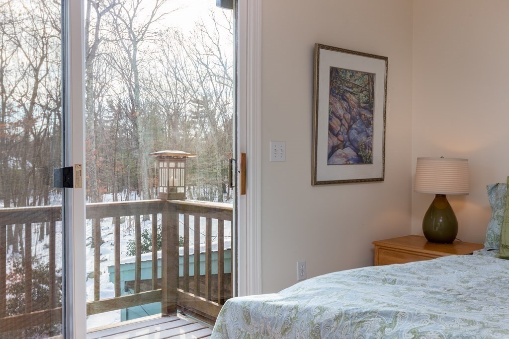 82 Nashoba Road Littleton, MA 01460 - Photo 16 of 39 a bedroom with a bed and a painting on the wall