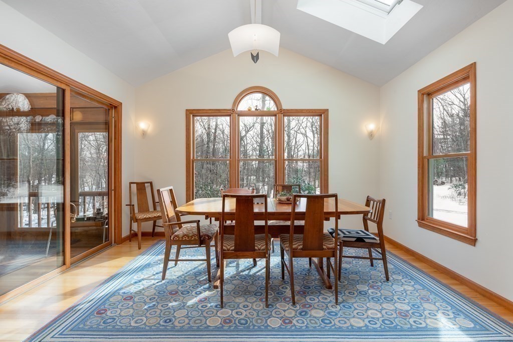 82 Nashoba Road Littleton, MA 01460 - Photo 2 of 39 a view of a dining room with furniture window and wooden floor