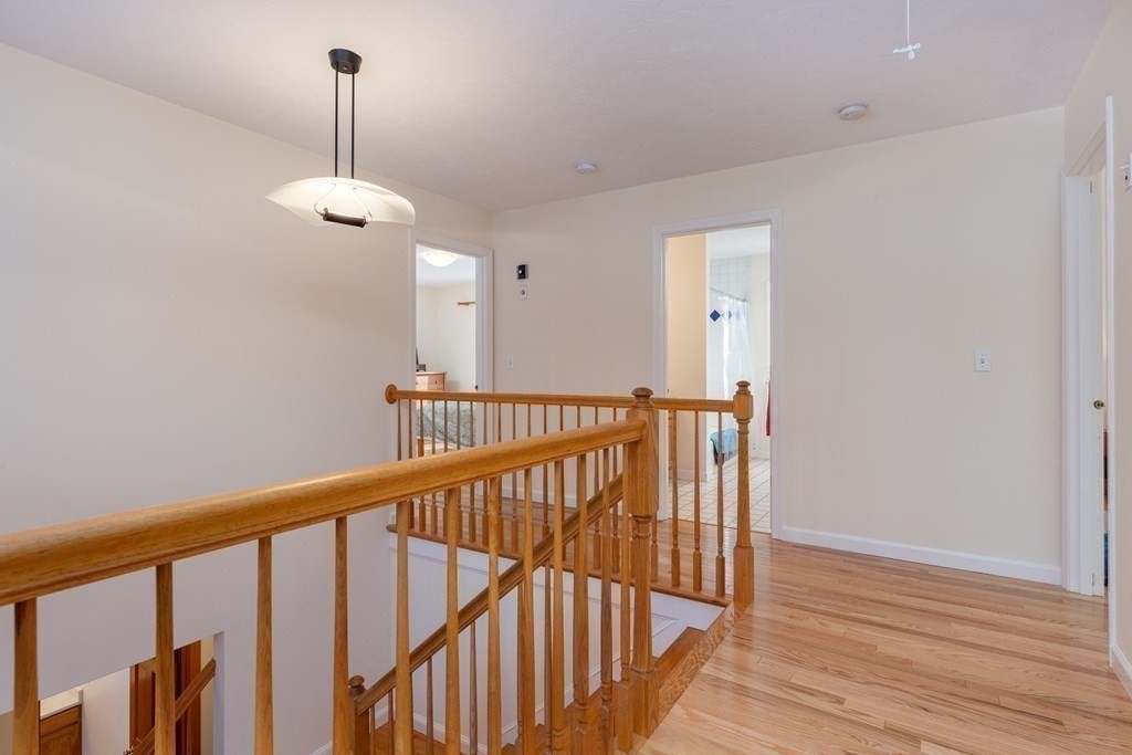 82 Nashoba Road Littleton, MA 01460 - Photo 21 of 39 a view of a hallway with a stairs