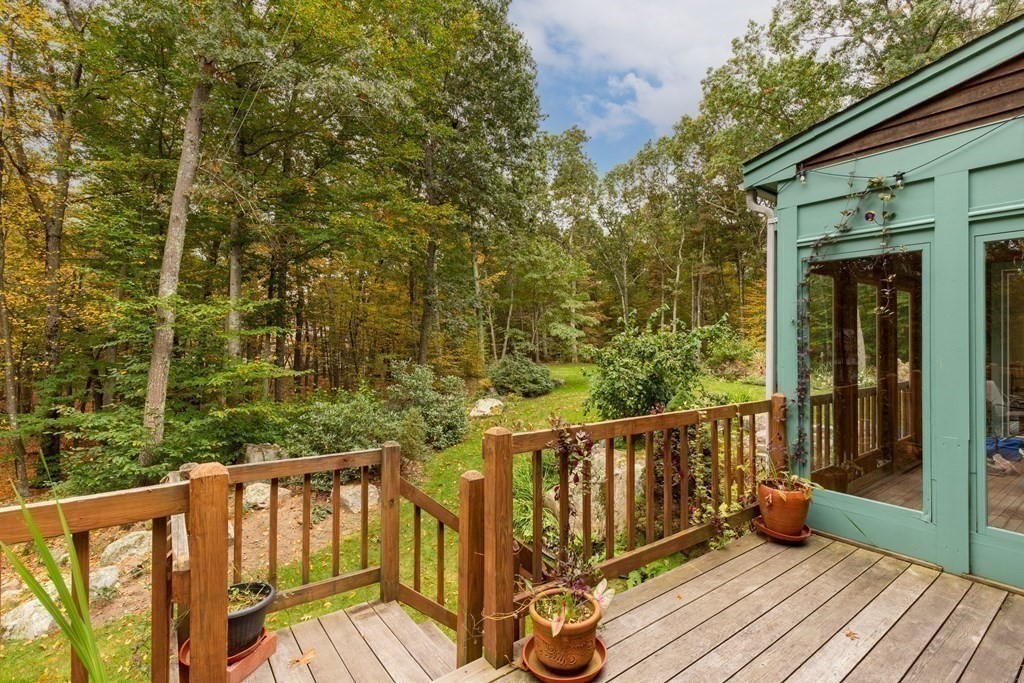 82 Nashoba Road Littleton, MA 01460 - Photo 24 of 39 a view of deck with wooden floor and outdoor seating