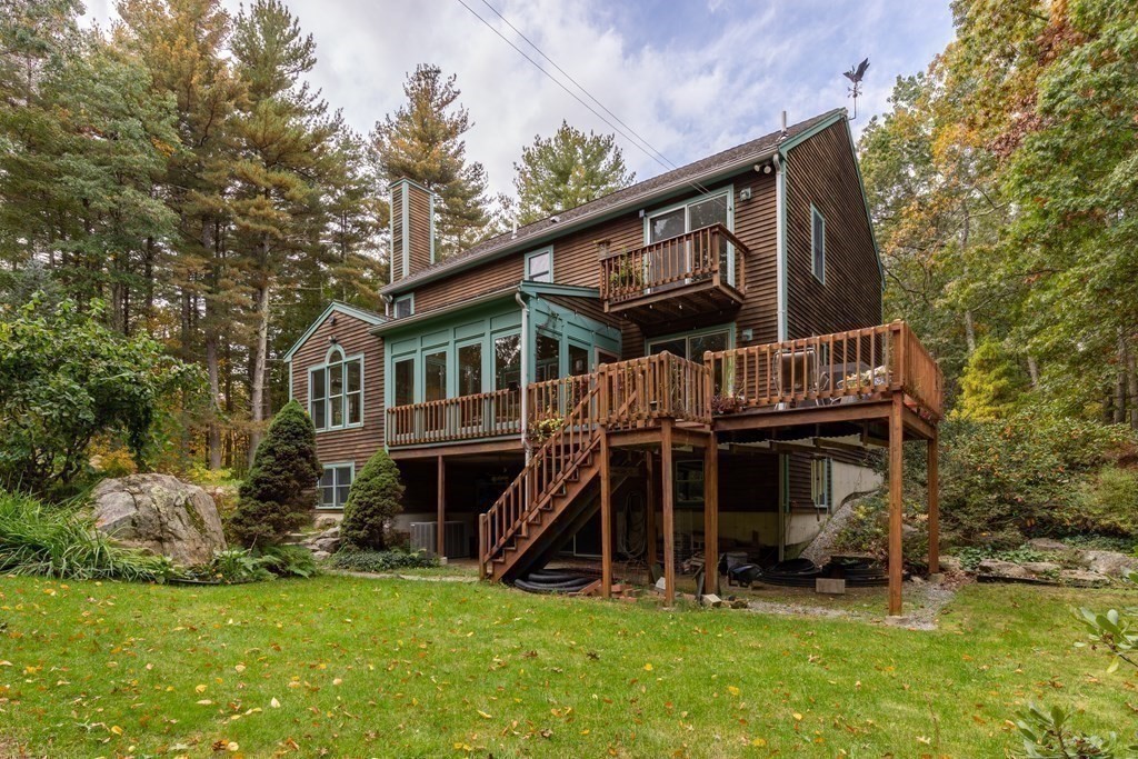 82 Nashoba Road Littleton, MA 01460 - Photo 30 of 39 a view of house with yard and staircase