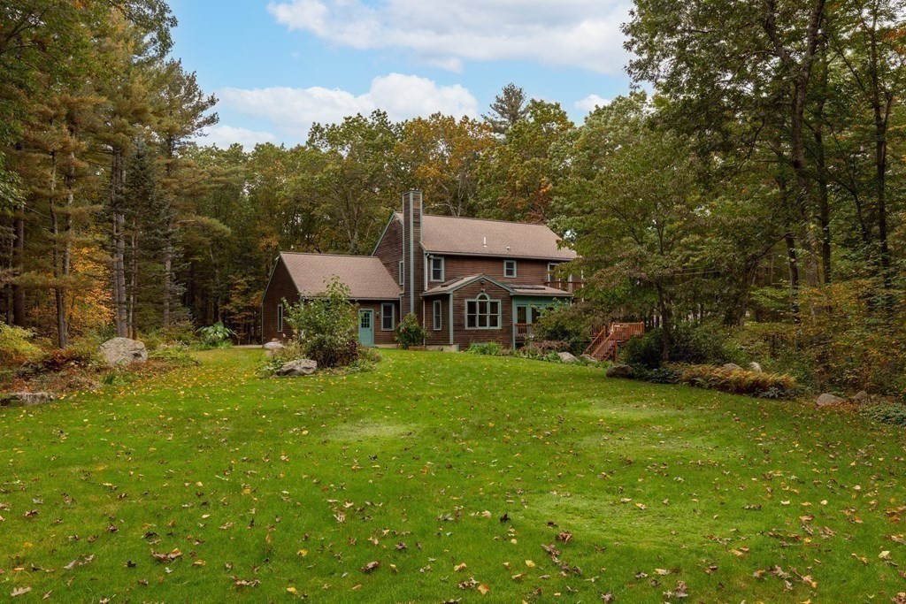82 Nashoba Road Littleton, MA 01460 - Photo 31 of 39 a view of a house with a backyard