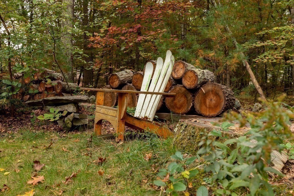 82 Nashoba Road Littleton, MA 01460 - Photo 35 of 39 a backyard of a house with table and chairs