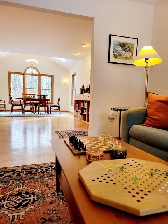 82 Nashoba Road Littleton, MA 01460 - Photo 9 of 39 a living room with furniture and a table