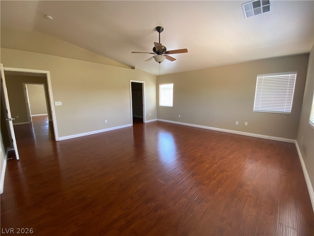 489 Foster Springs Road Las Vegas, NV 89148 - Photo 12 of 30 Ample living space with warm wood floors and abundant natural light throughout.