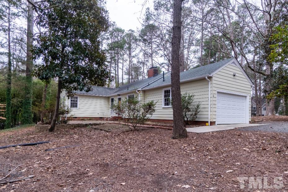 2 Maple Drive Chapel Hill, NC 27514 - Photo 17 of 57 a view of a house with a yard and large tree