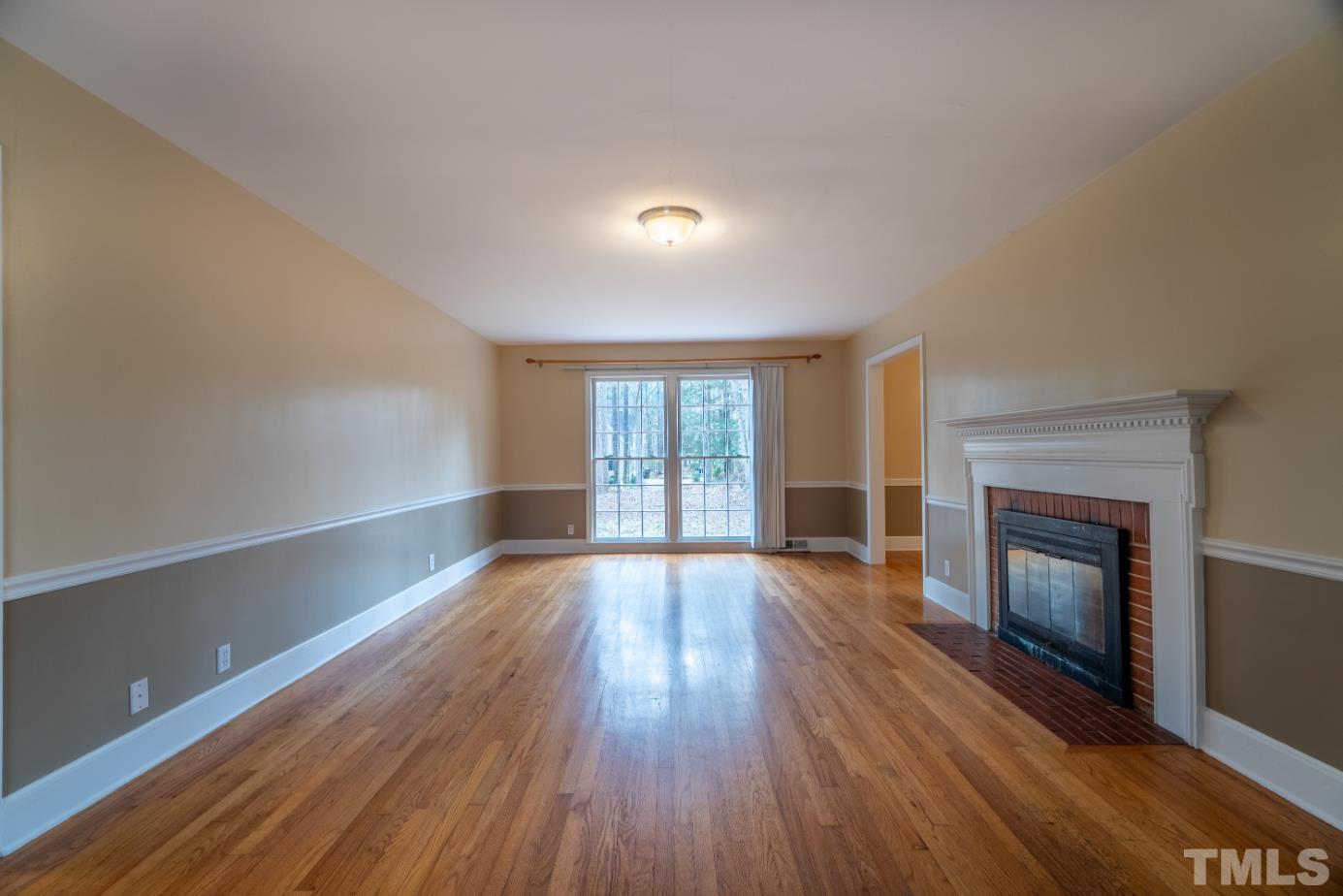 2 Maple Drive Chapel Hill, NC 27514 - Photo 22 of 57 wooden floor in an empty room with a window