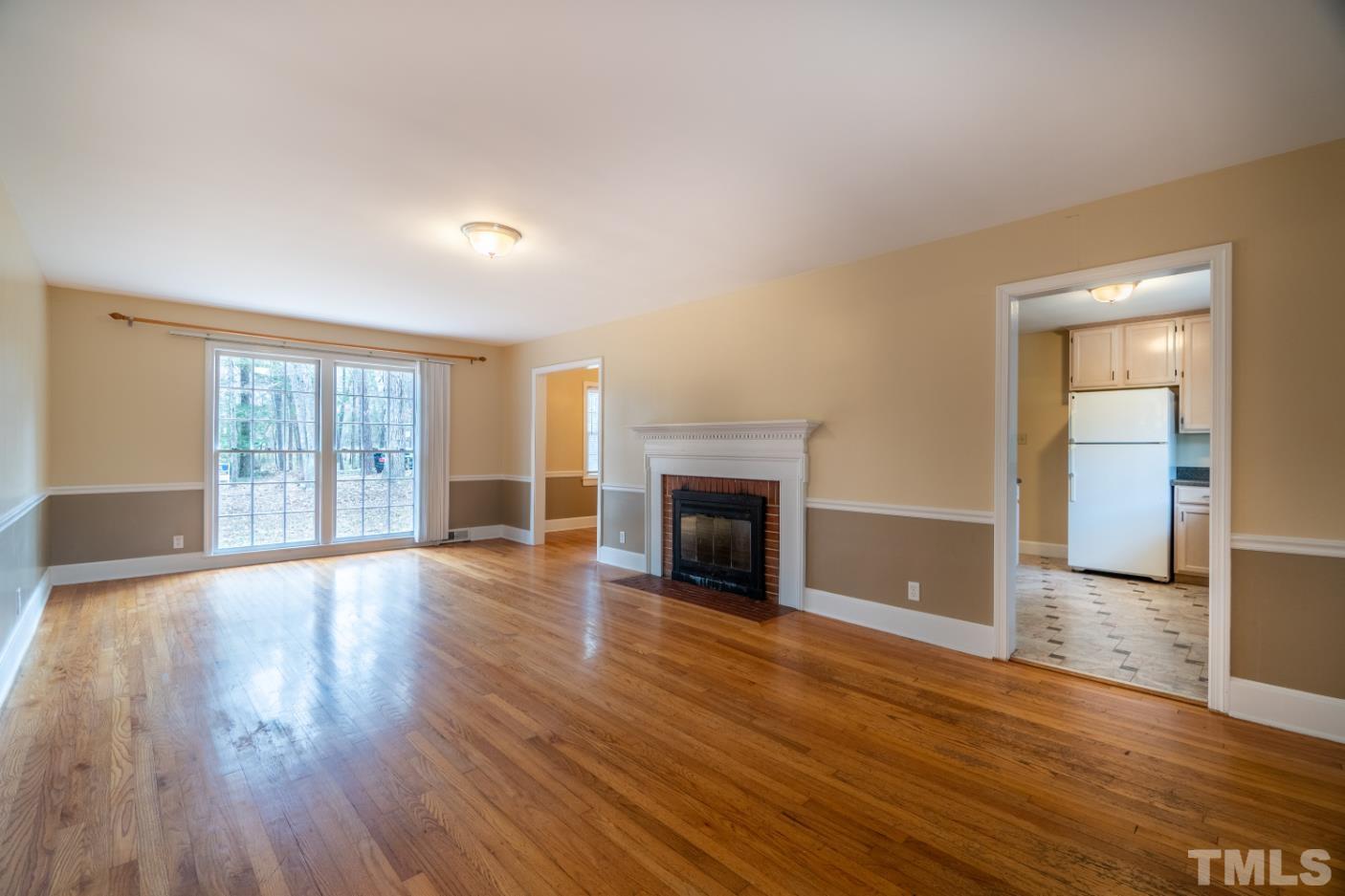 2 Maple Drive Chapel Hill, NC 27514 - Photo 23 of 57 a view of an empty room with wooden floor and a window