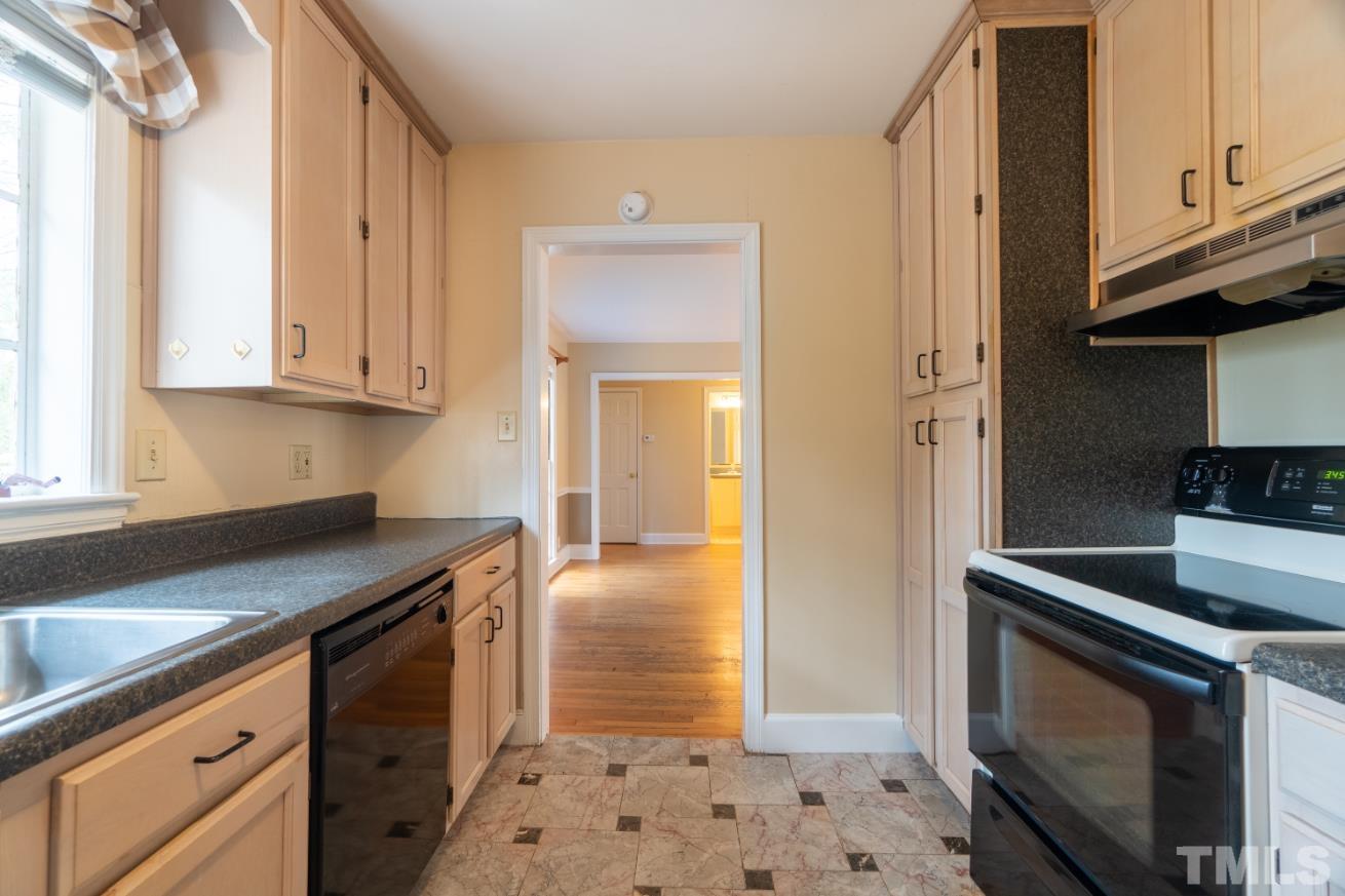 2 Maple Drive Chapel Hill, NC 27514 - Photo 42 of 57 a kitchen with stainless steel appliances granite countertop a stove a microwave and a sink