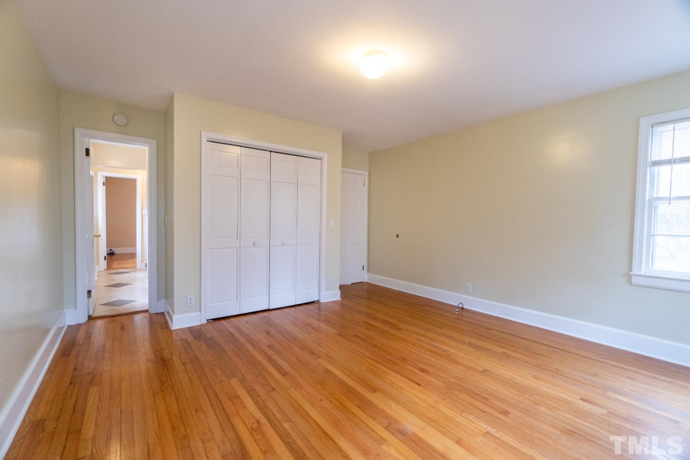 2 Maple Drive Chapel Hill, NC 27514 - Photo 56 of 57 a view of empty room with wooden floor and fan