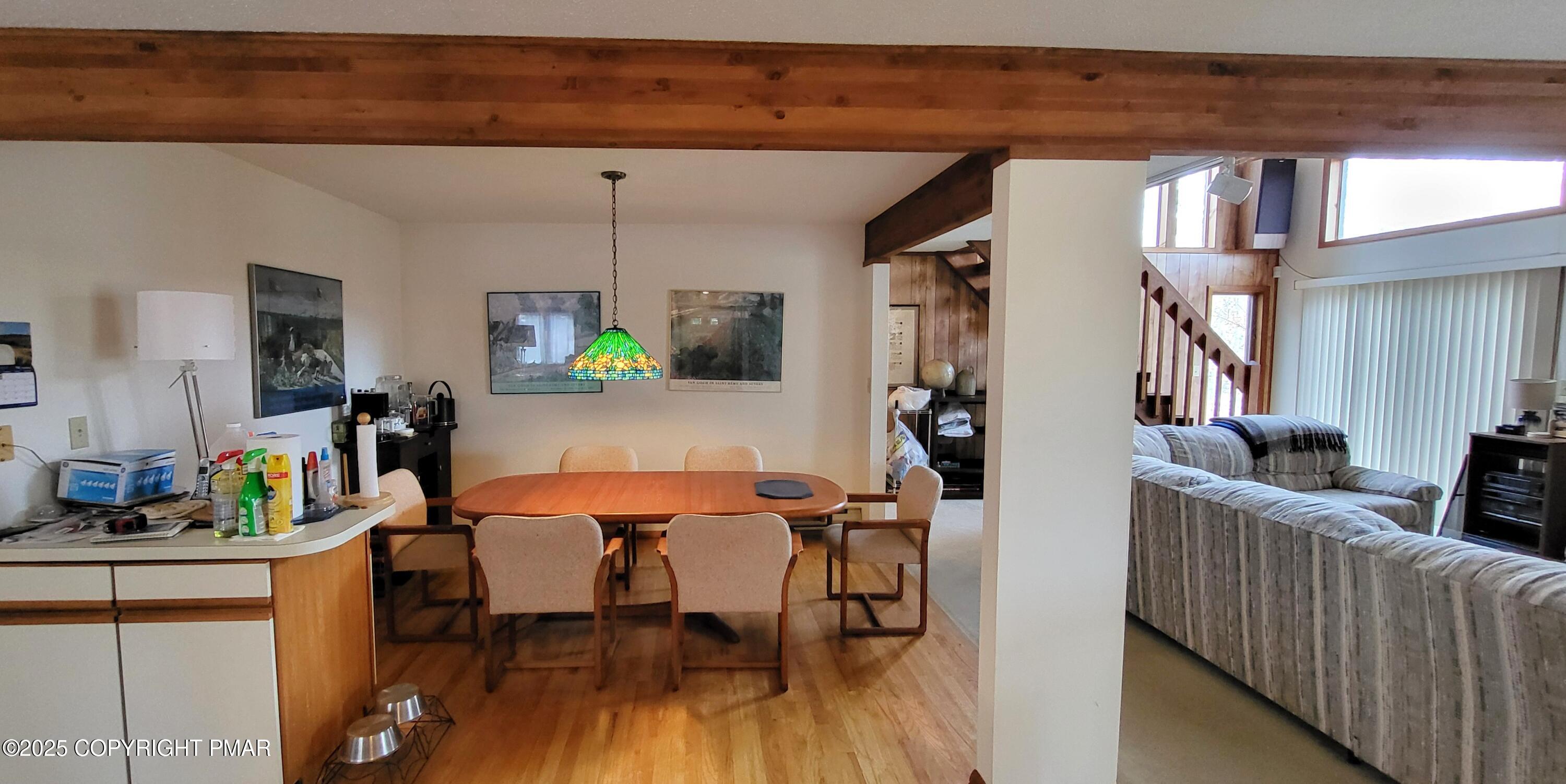 130 Bellingham Drive Bushkill, PA 18324 - Photo 11 of 65 a view of a dining room with furniture and wooden floor