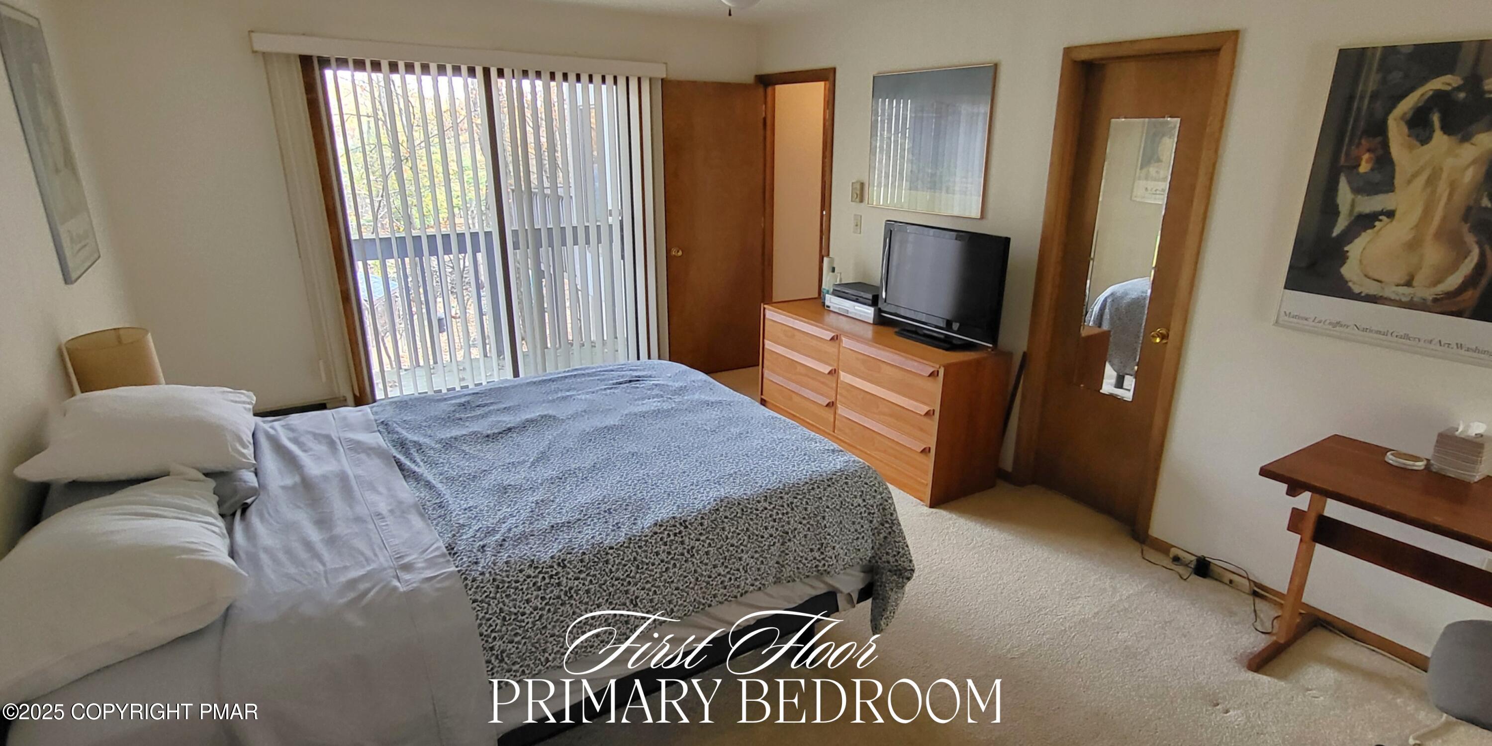 130 Bellingham Drive Bushkill, PA 18324 - Photo 17 of 65 a bedroom with a bed and a flat screen tv