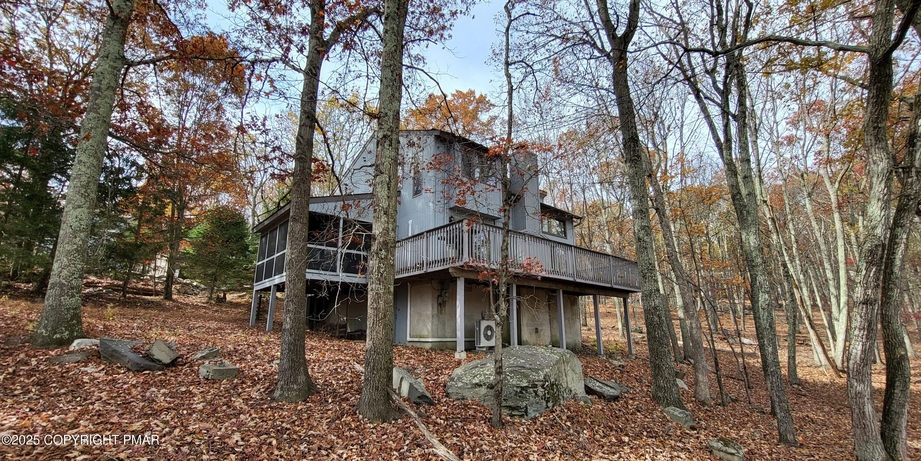 130 Bellingham Drive Bushkill, PA 18324 - Photo 2 of 65 a house with trees in front of it