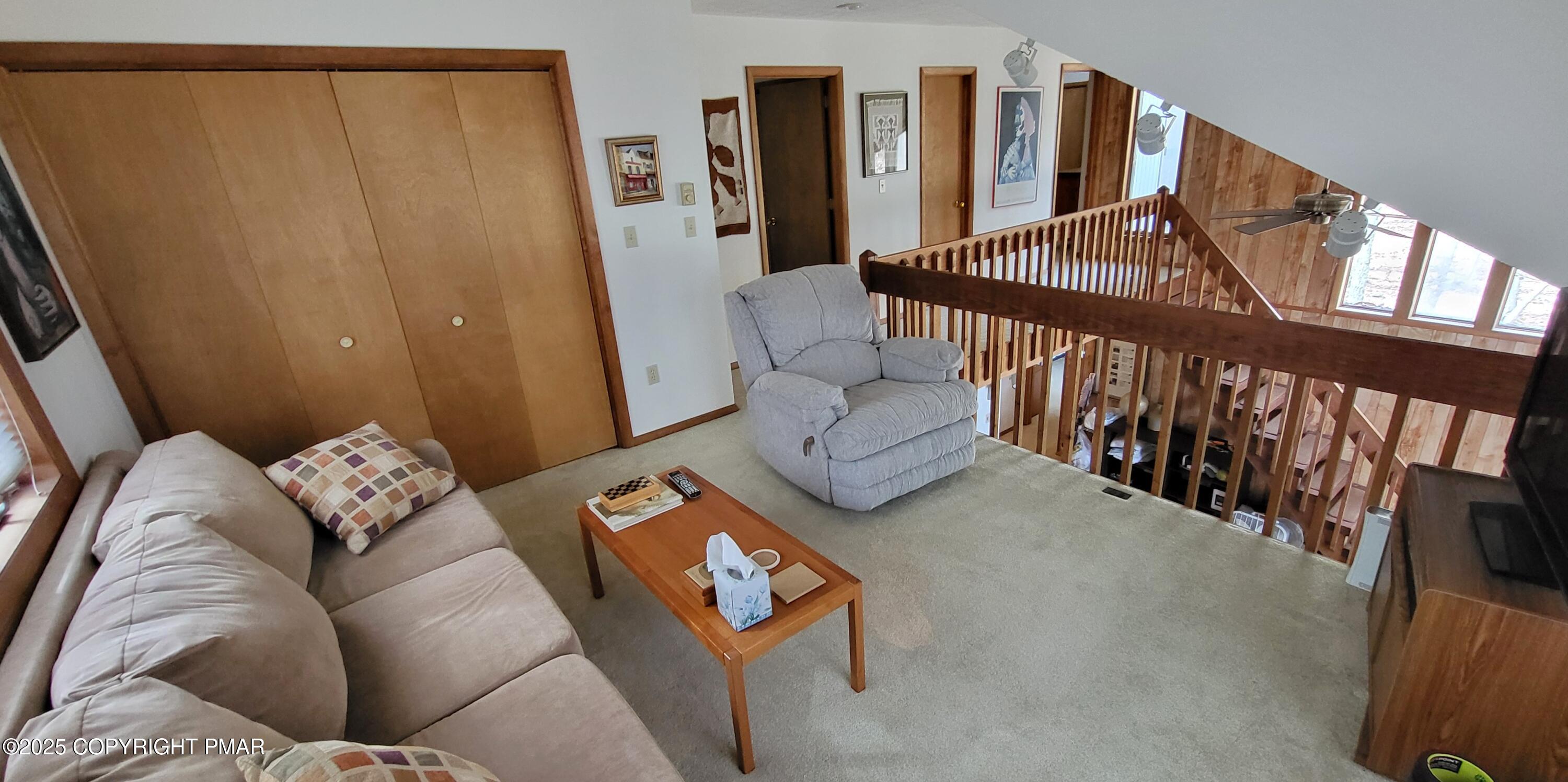 130 Bellingham Drive Bushkill, PA 18324 - Photo 28 of 65 a living room with furniture and stairs