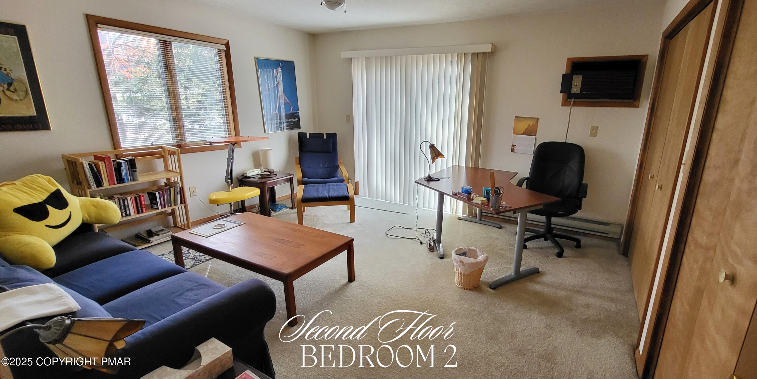 130 Bellingham Drive Bushkill, PA 18324 - Photo 28 of 65 a view of a livingroom with furniture and a window