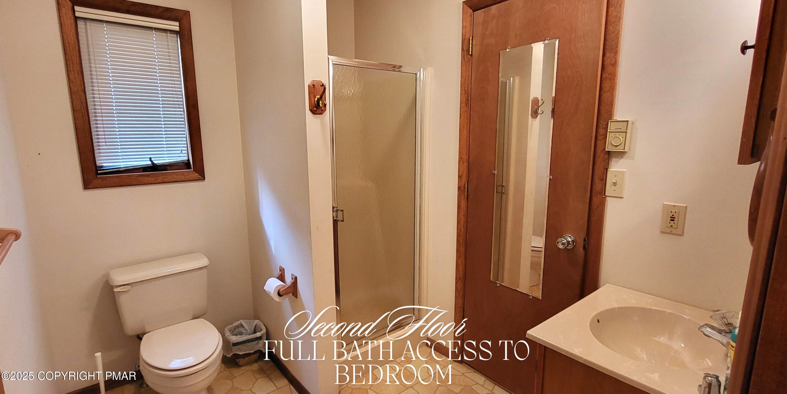 130 Bellingham Drive Bushkill, PA 18324 - Photo 31 of 65 a white toilet sitting next to a bathroom sink