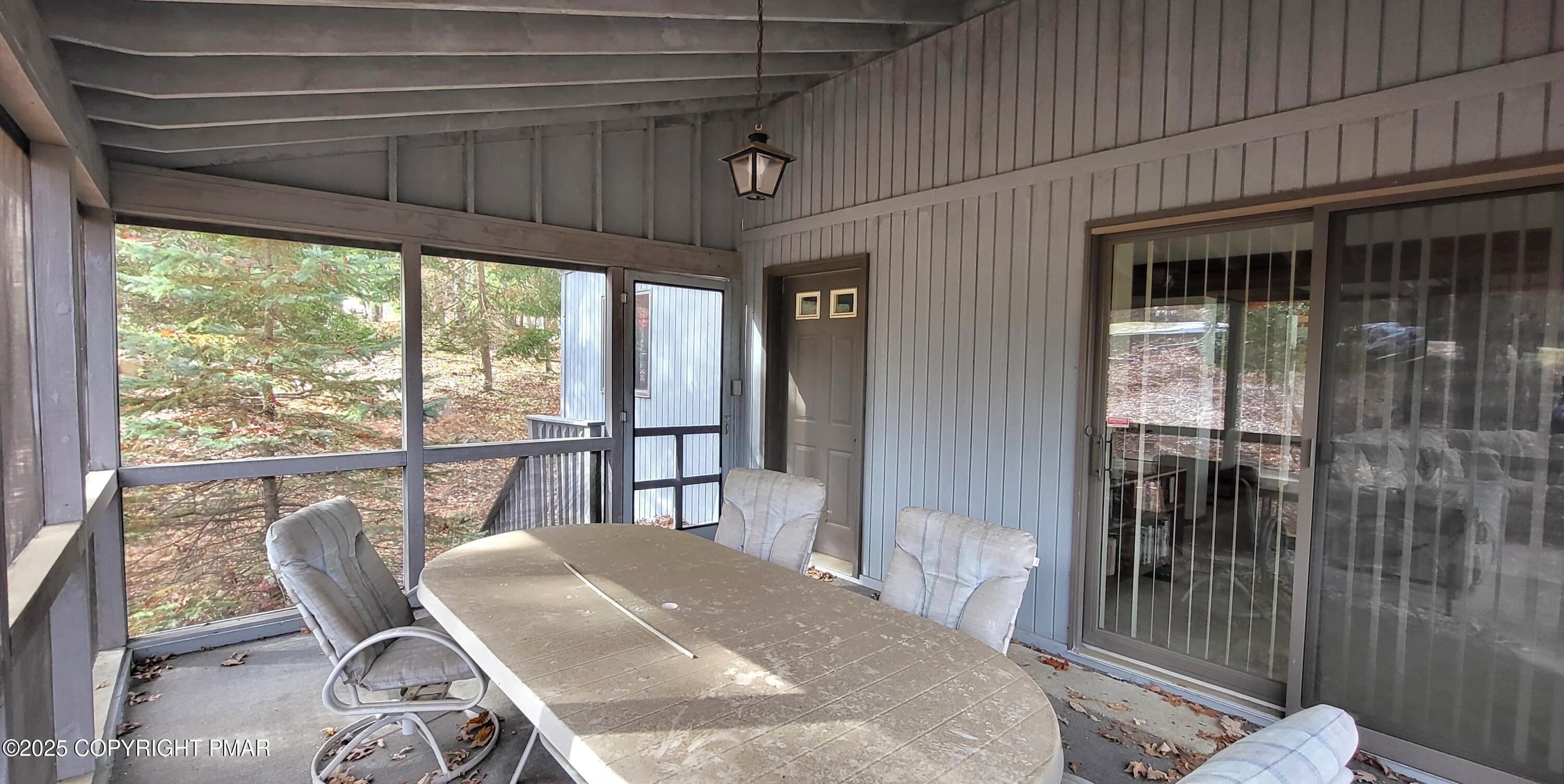 130 Bellingham Drive Bushkill, PA 18324 - Photo 36 of 65 a view of a dining room with furniture window and wooden floor