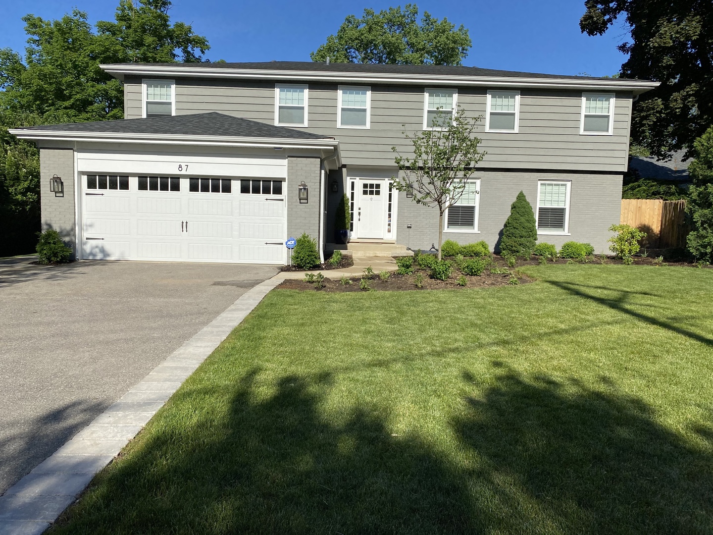 87 Ridge Road Highland Park, IL 60035 - Photo 1 of 27 front view of a house with a yard