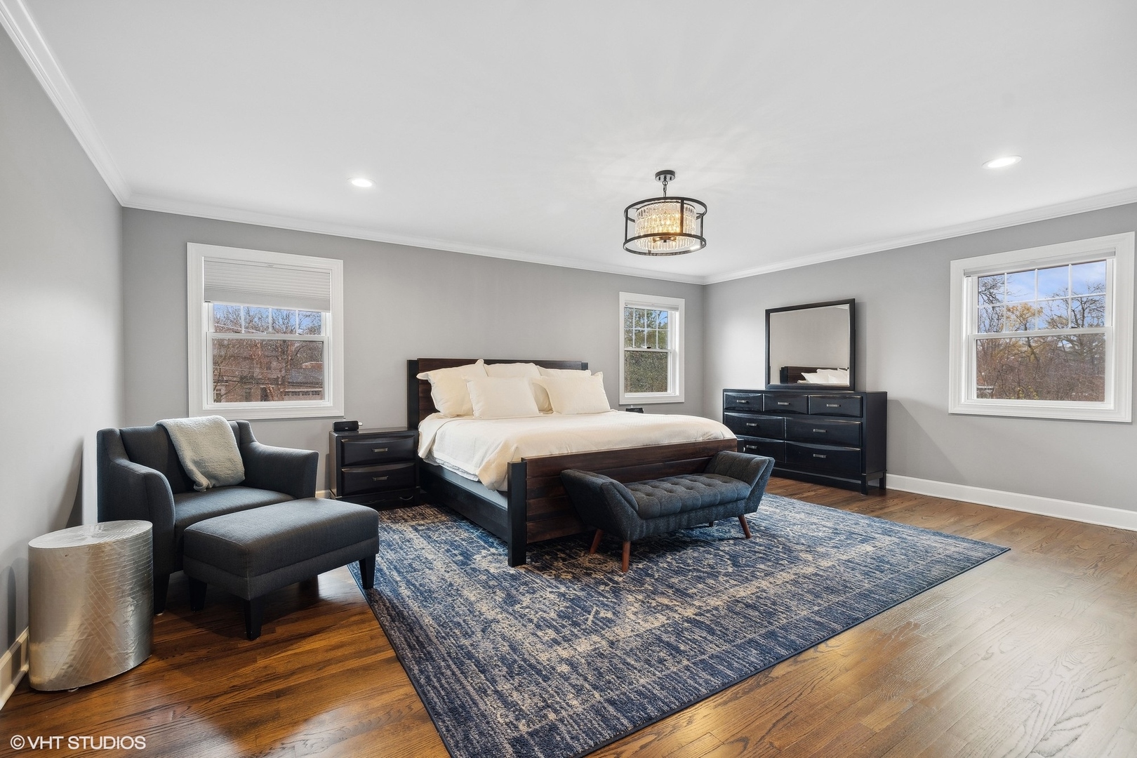 87 Ridge Road Highland Park, IL 60035 - Photo 14 of 27 a spacious bedroom with a bed a couch and window