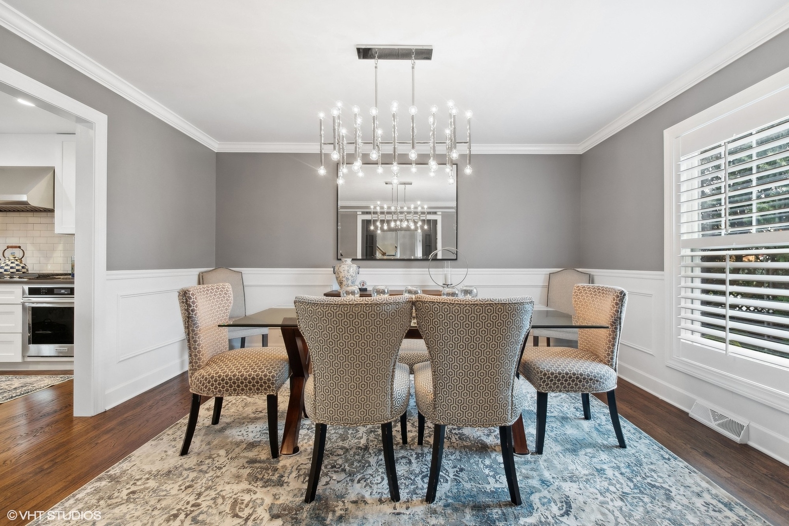 87 Ridge Road Highland Park, IL 60035 - Photo 4 of 27 a view of a dining room with furniture a chandelier and wooden floor