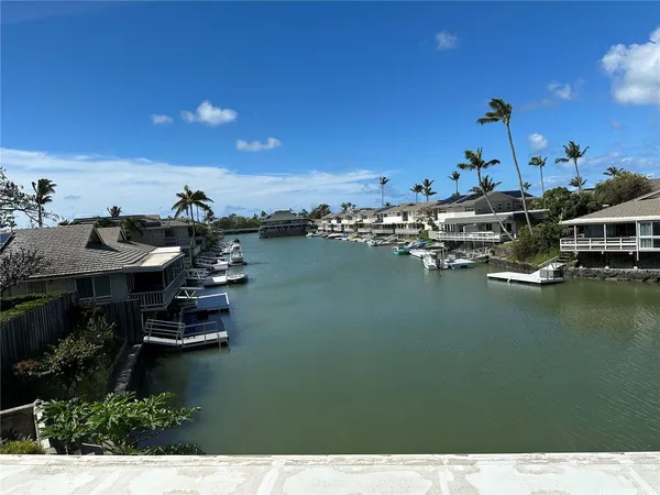 a view of a lake in middle of house