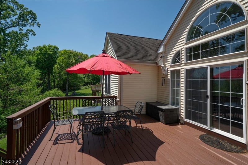 15 Bracken Hill Road Hamburg, NJ 07419 - Photo 36 of 44 a view of a roof deck with a chair and potted plants