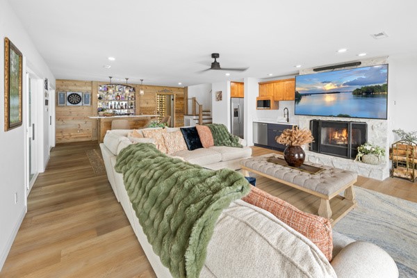516 Hillandale Road Seneca, SC 29672 - Photo 25 of 50 This expansive living area boasts a cozy fireplace and a fully equipped bar, perfect for entertaining.