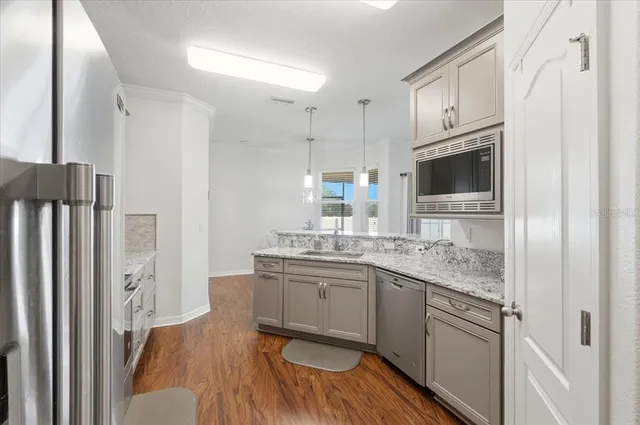 a kitchen with appliances and cabinets