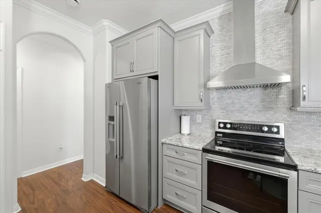 a view of a a dining room with furniture window and wooden floor