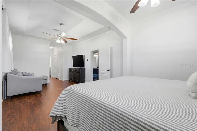 a bathroom with a tub a window and a shower