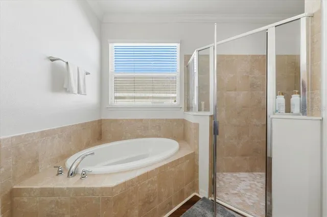 a bathroom with a granite countertop double vanity sink and a mirror