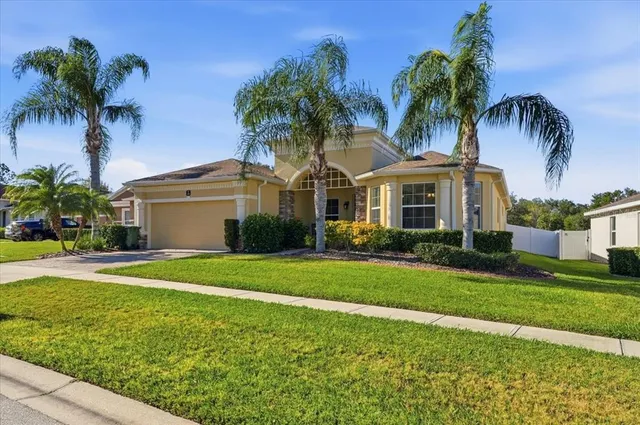 a front view of house with yard and outdoor seating