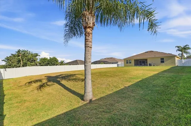 a view of a house with backyard