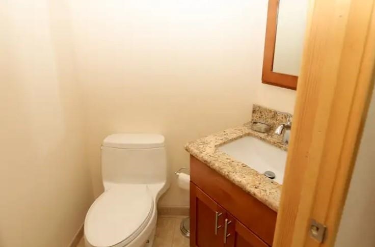 1032 South Kihei Road, Unit A103 Kihei, HI 96753 - Photo 18 of 48 a bathroom with a granite countertop toilet and a sink