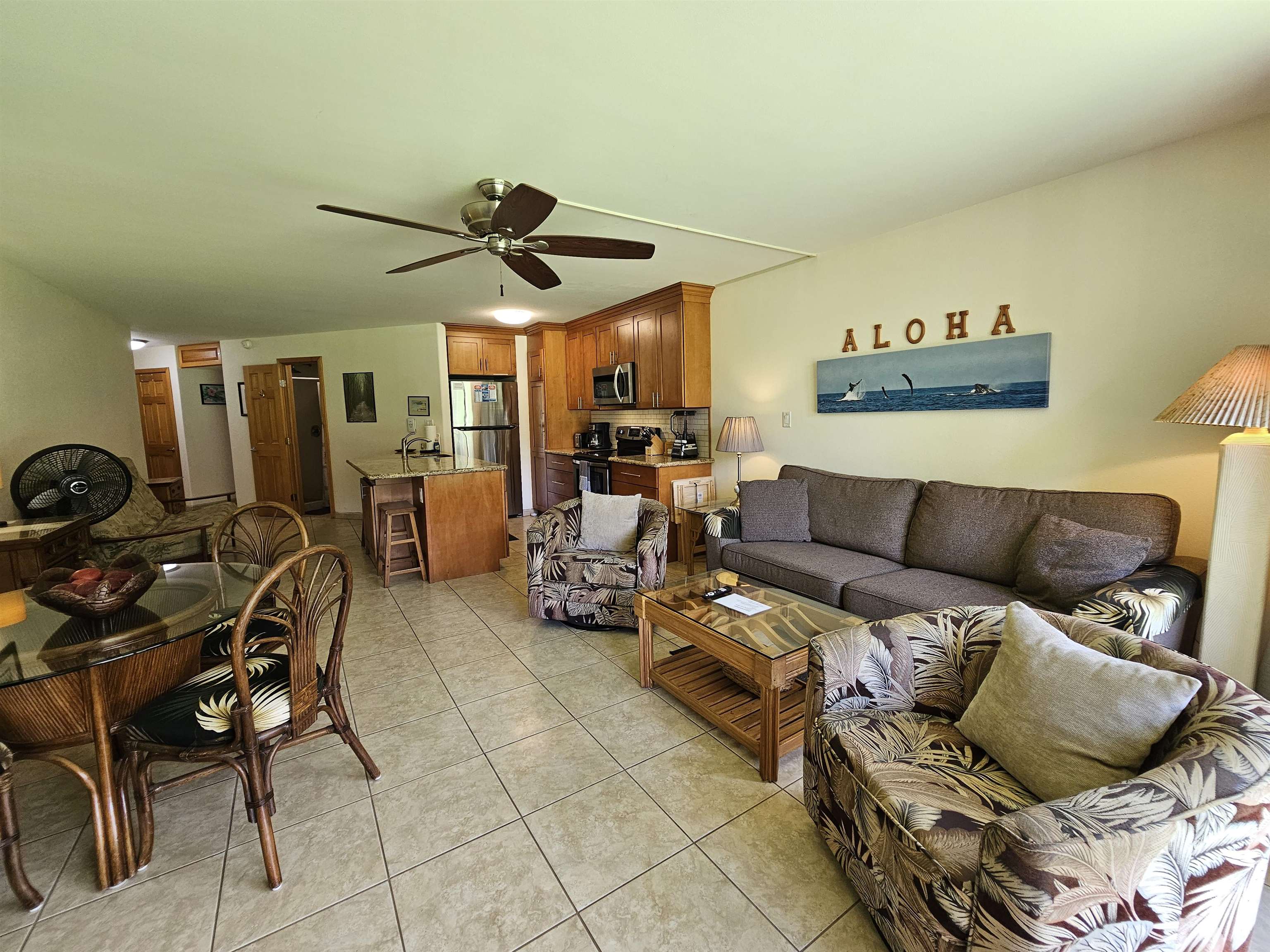 1032 South Kihei Road, Unit A103 Kihei, HI 96753 - Photo 20 of 48 a living room with furniture a couch and ceiling fan