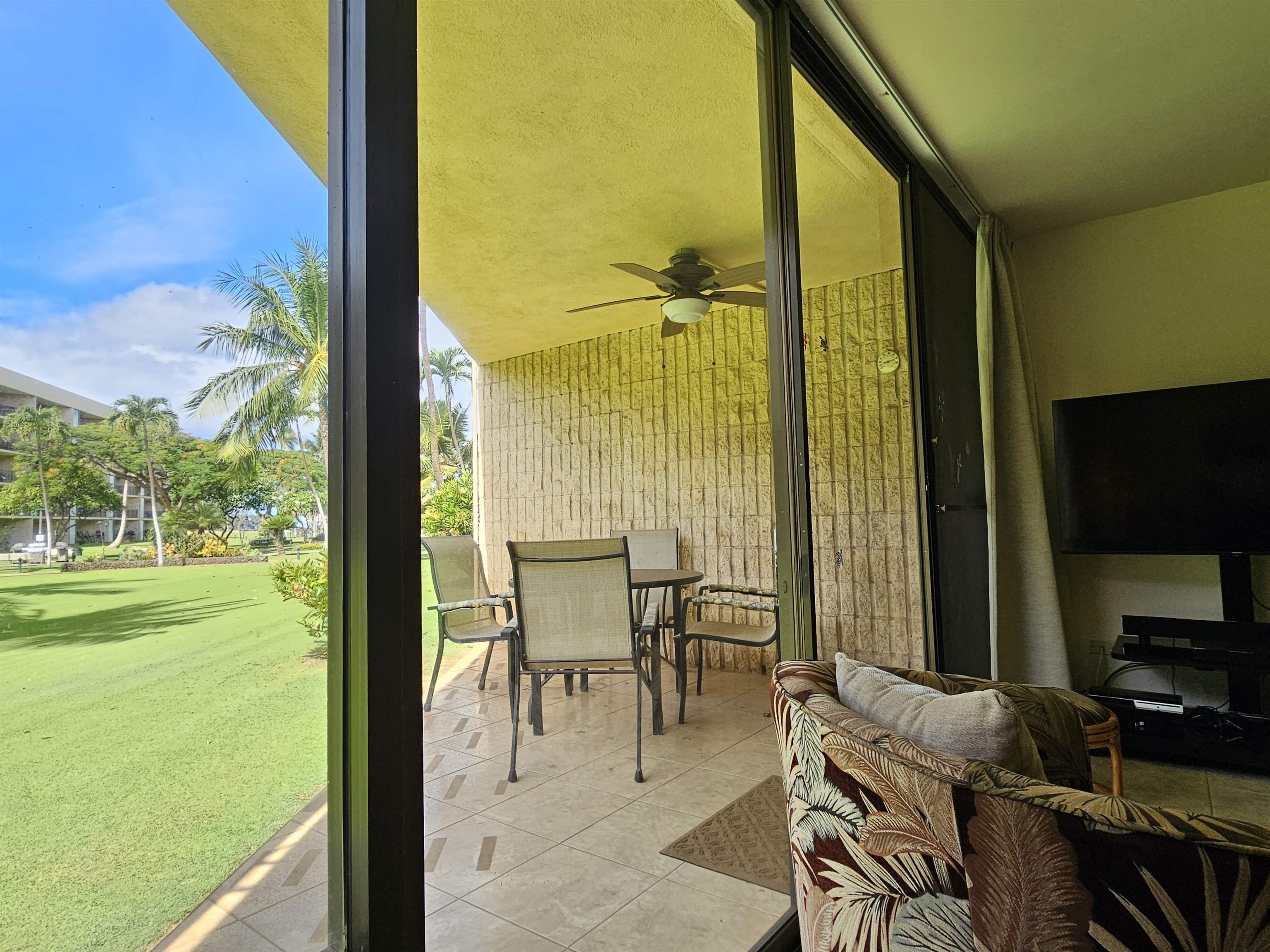 1032 South Kihei Road, Unit A103 Kihei, HI 96753 - Photo 22 of 48 a view of an outdoor space with seating area