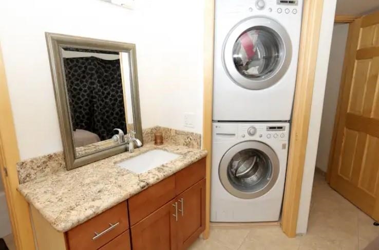 1032 South Kihei Road, Unit A103 Kihei, HI 96753 - Photo 35 of 48 a bathroom with a granite countertop sink and a mirror