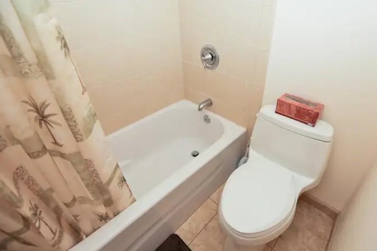1032 South Kihei Road, Unit A103 Kihei, HI 96753 - Photo 37 of 48 a bathroom with a toilet and a bathtub
