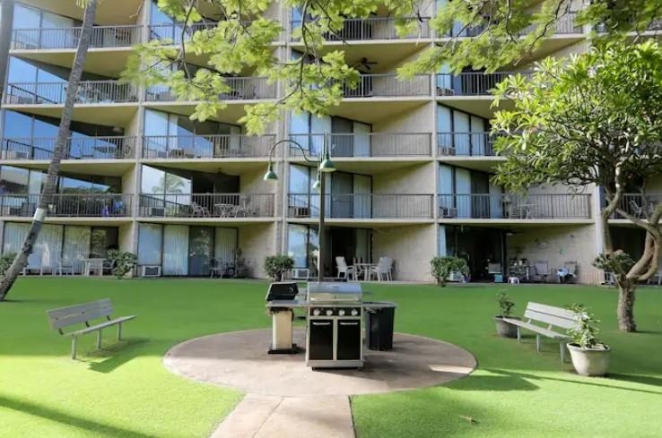1032 South Kihei Road, Unit A103 Kihei, HI 96753 - Photo 43 of 48 a view of a house with a yard and sitting area