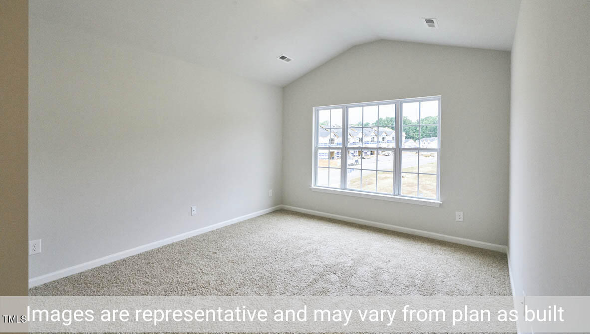 5344 Henley Ridge Drive, Unit 228 Graham, NC 27253 - Photo 18 of 30 a view of an empty room with a window