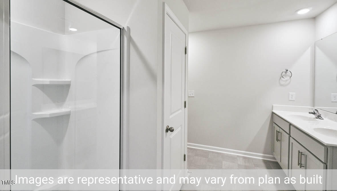 5344 Henley Ridge Drive, Unit 228 Graham, NC 27253 - Photo 23 of 30 a view of a bathroom from the hallway