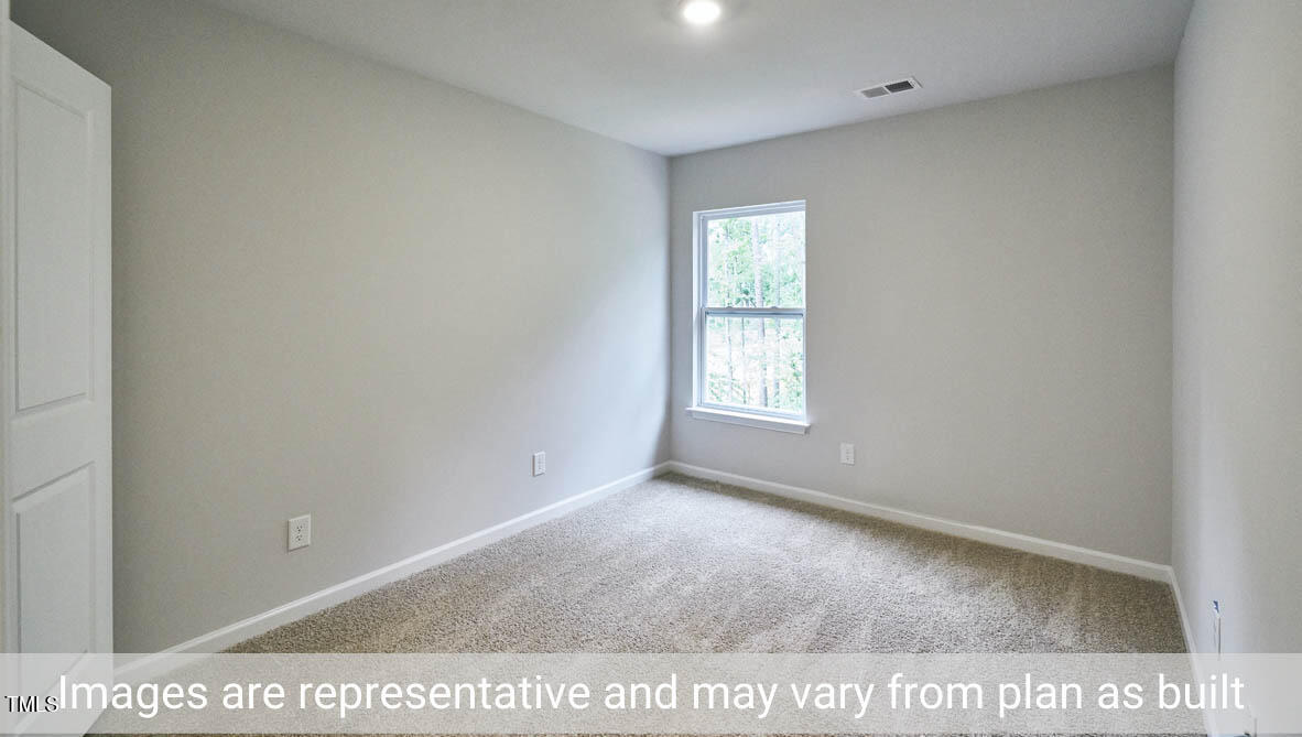 5344 Henley Ridge Drive, Unit 228 Graham, NC 27253 - Photo 25 of 30 a view of an empty room and window