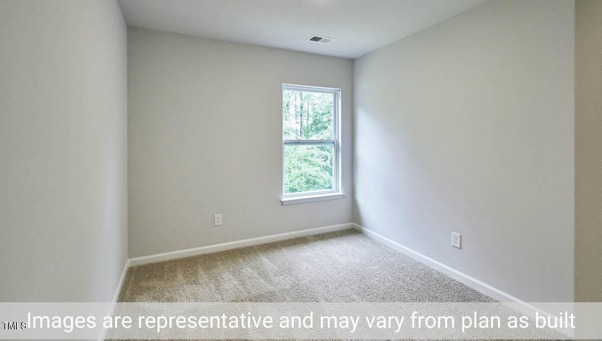 5344 Henley Ridge Drive, Unit 228 Graham, NC 27253 - Photo 26 of 30 a view of an empty room and window
