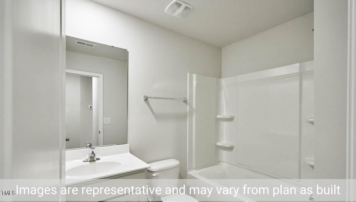 5344 Henley Ridge Drive, Unit 228 Graham, NC 27253 - Photo 27 of 30 a bathroom with a sink a toilet and shower