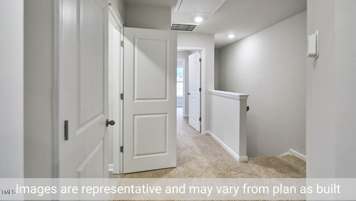 5344 Henley Ridge Drive, Unit 228 Graham, NC 27253 - Photo 28 of 30 a view of a hallway with wooden floor