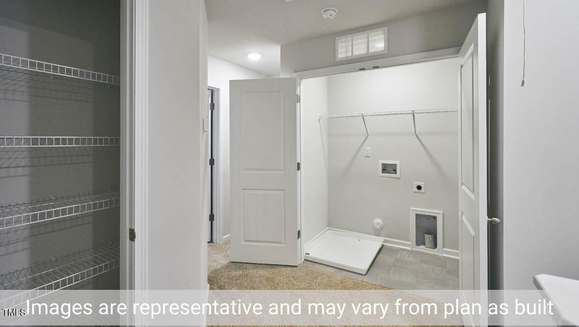 5344 Henley Ridge Drive, Unit 228 Graham, NC 27253 - Photo 29 of 30 a view of a bathroom with a glass door shower