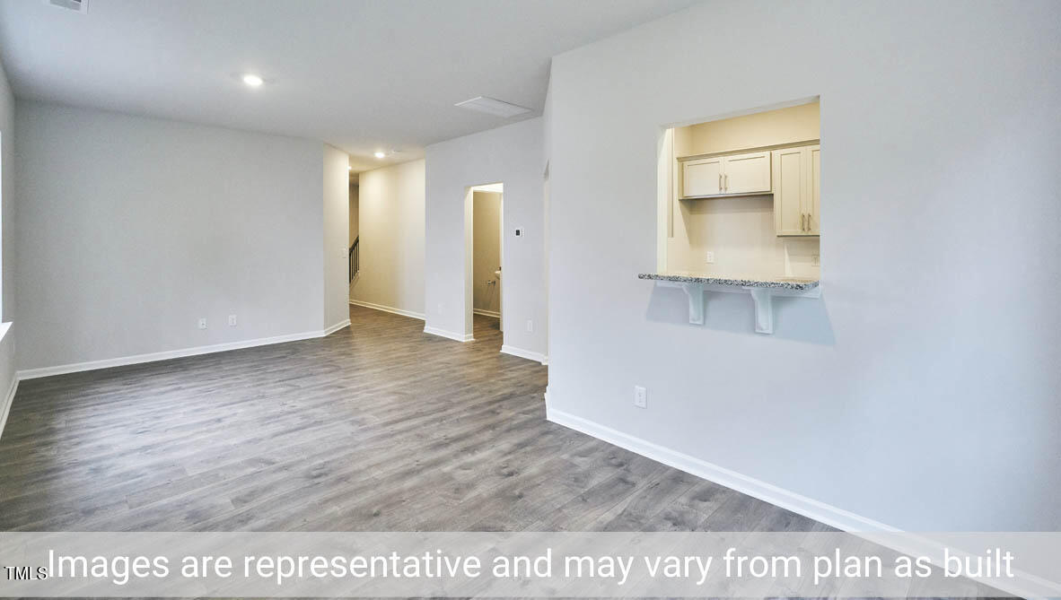 5344 Henley Ridge Drive, Unit 228 Graham, NC 27253 - Photo 9 of 30 a view of a room with wooden floor
