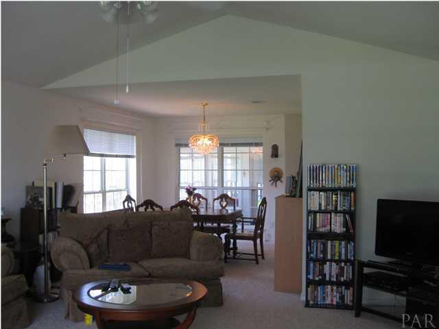 579 Riola Place Pensacola, FL 32506 - Photo 2 of 23 Off the foyer is the great room with soaring ceiling and open concept to dining room
