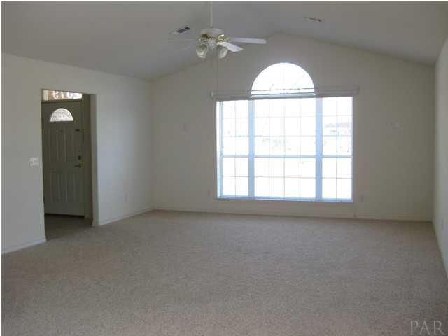 579 Riola Place Pensacola, FL 32506 - Photo 4 of 23 Great Room vacant....Wonderful window in Great Room with decorative arch floods the room with light. This home has TONS OF NATURAL LIGHT!
