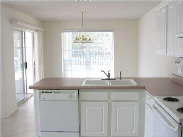 579 Riola Place Pensacola, FL 32506 - Photo 7 of 23 Breakfast bar, large breakfast area, open to Dining room as well. Looking into the breakfast area with sunporch off to the side.